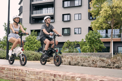 Young male and female couple riding DYU D3+ electric bike Australia in park
